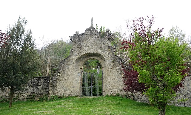 Gates surrounded by trees and bushes