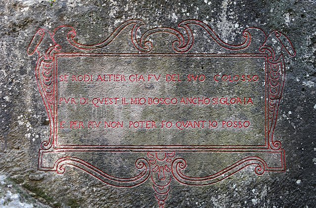 Message inscribed in red on a piece of stone