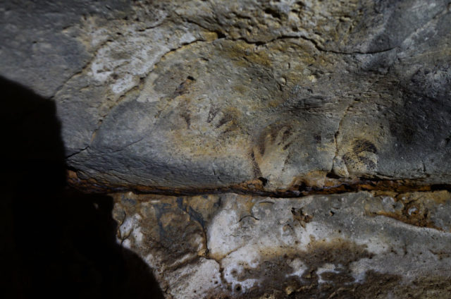 Mayan cave paintings on the walls of a cenote