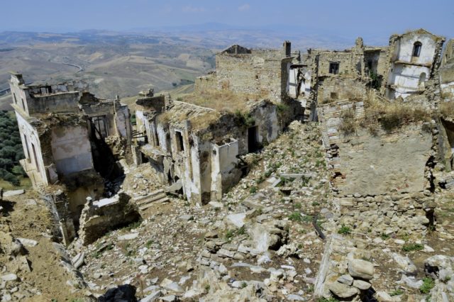 An aerial view of decaying buildings in the abandoned village of Craco, Italy