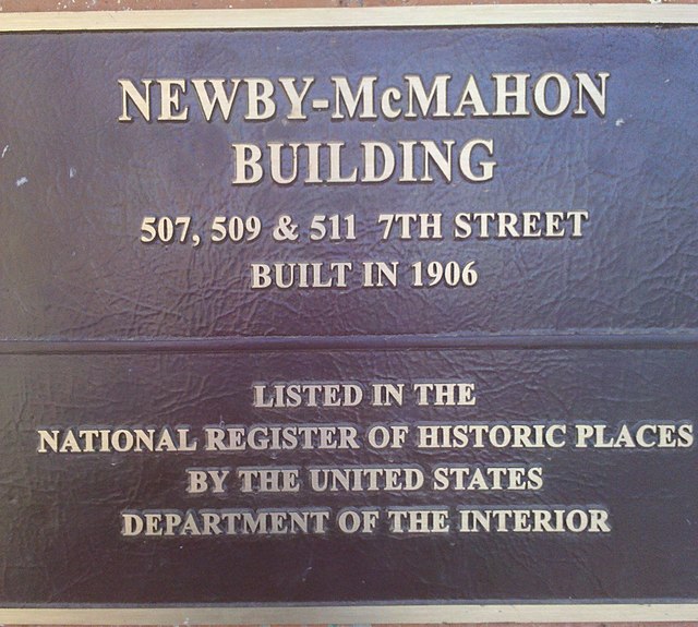 Close-up of the plaque outside of the Newby-McMahon Building