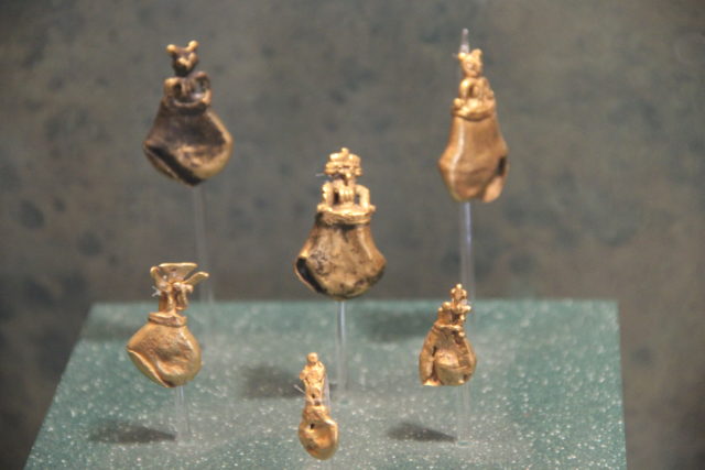 Small Mayan gold statues on display