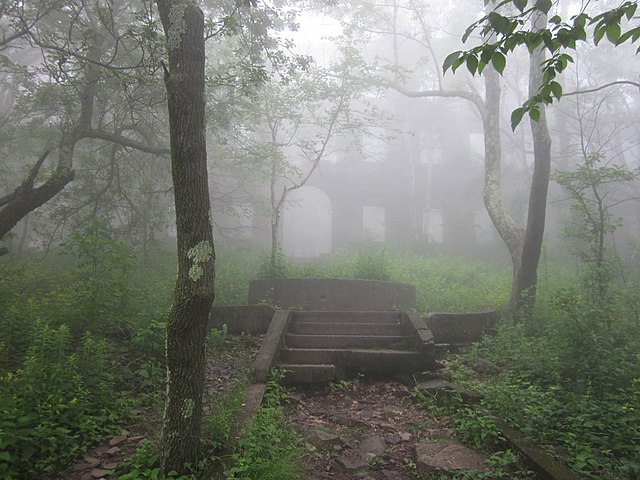 Exterior of Overlook Mountain House shrouded by fog