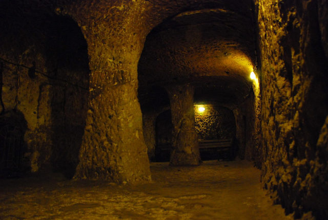 The dimly lit underground tunnels of Derinkuyu