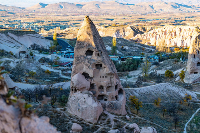 A fairy chimney or rock formation with carved out homes