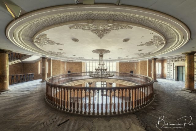 Chandelier hanging from the ceiling of a large room