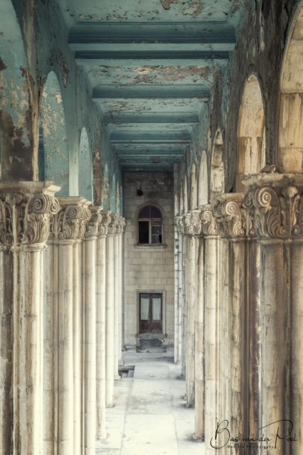 Stone columns along the outside of a hallway