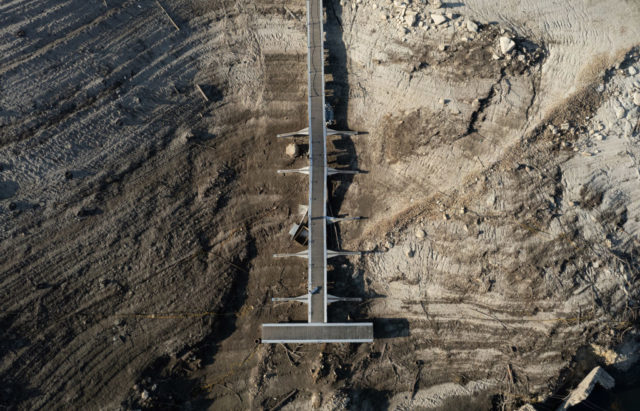 Aerial view of people walking on a bridge