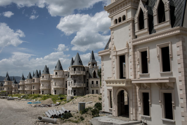 A road showing multiple castle villas at Burj Al Babas