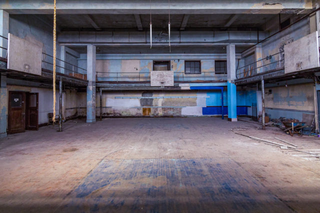 Basketball hoop at the far-end of the J.W. Cooper gymnasium