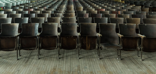 Rows of seats in the theater of the J.W. Cooper School