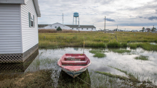 Boat parked on a flooded lawn