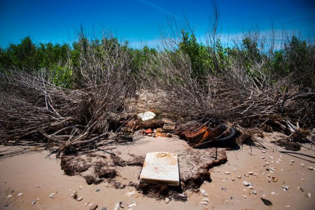 Gravestone lying on the beach on Tangier Island