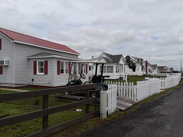 Golf cart parked outside of a house