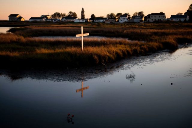 Wooden cross in the middle of a marsh on Tangier Island