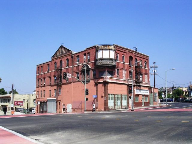 A red brick building, the Boyle Hotel from across the street.