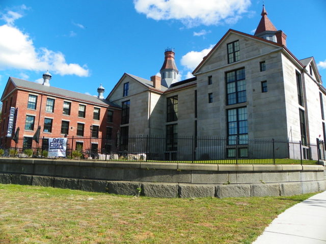 Freshly renovated Salem Jail made of grey brick.