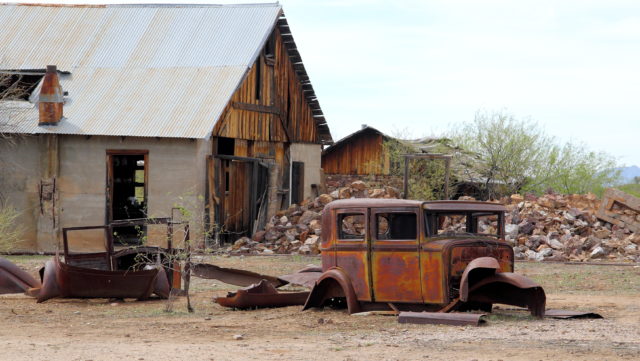 An abandoned building and car at Vulture City
