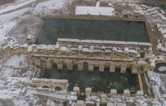 Aerial view of people swimming at the Basilica Therma