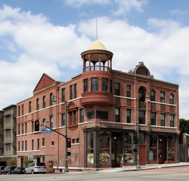 Boyle Hotel, a red brick building on a corner block, after renovations with an added turret. 