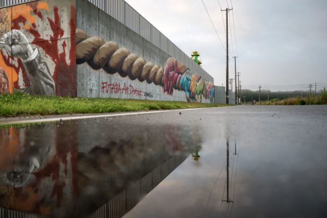 Graffiti on the exterior wall of a large building