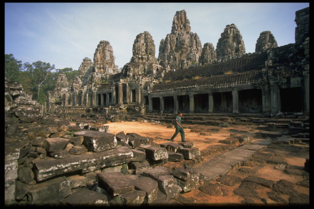 Man walking through Ta Prohm