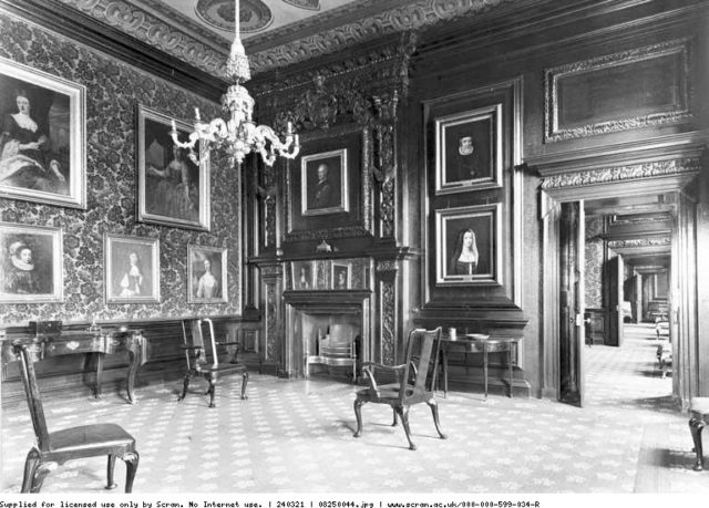 Portraits and chairs inside a room at the former Hamilton Palace