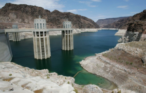 Lake Mead observation towers with mountains surrounding them and a low water level.