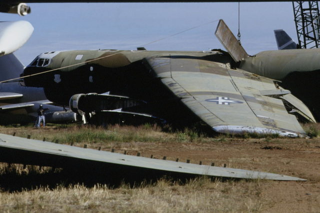 Damaged Boeing B-52 Stratofortress sitting in the grass