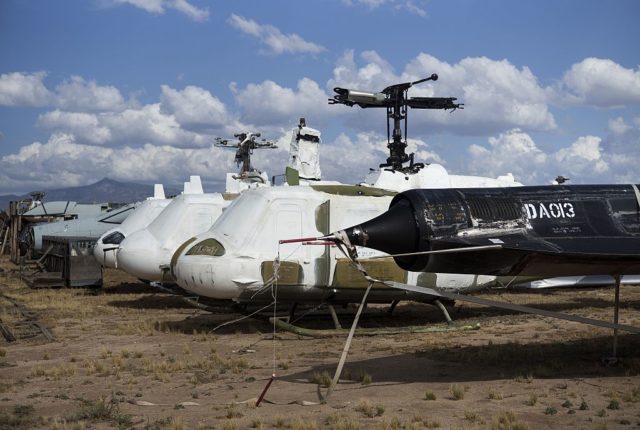 Lockheed D-21 reconnaissance drone parked beside damaged aircraft