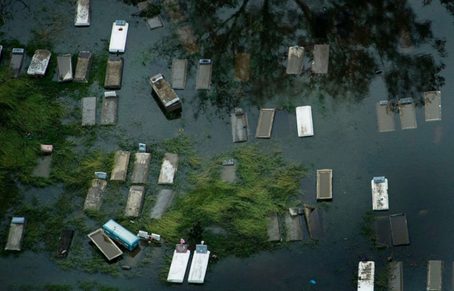 Aerial view of coffins floating in floodwaters