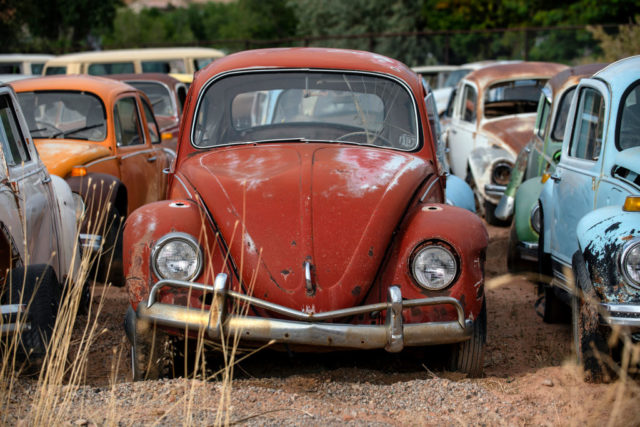 Old red Volkswagen Beatle.