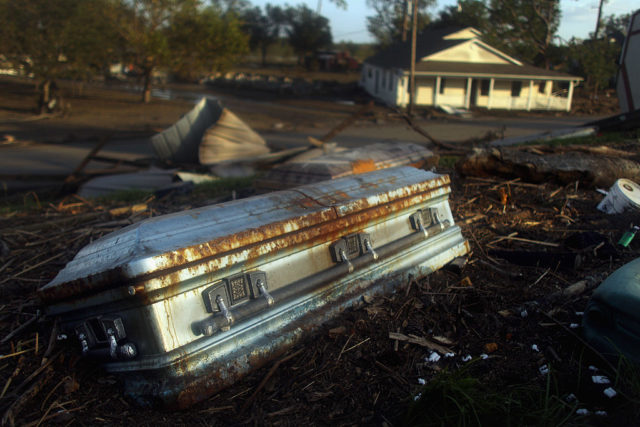 Coffin lying in debris