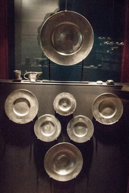 Several tin dishes on display