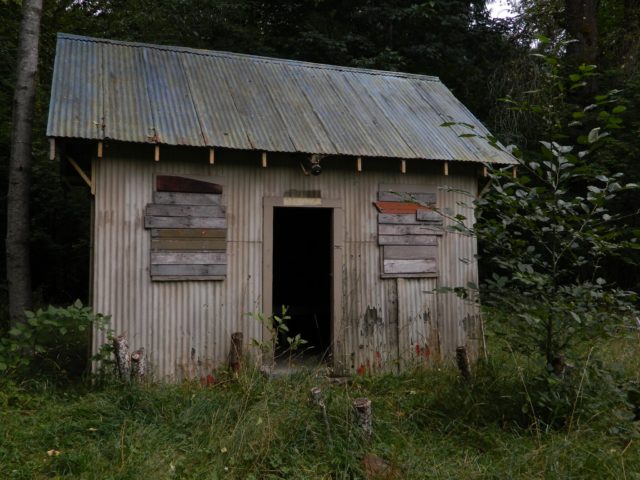 A boarded up grain shed