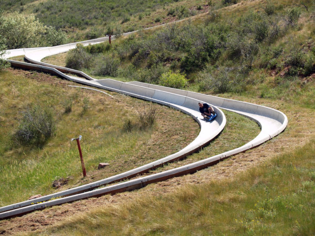 A person rides an alpine slide