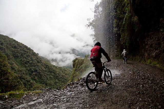 Two cyclists biking along Death Road