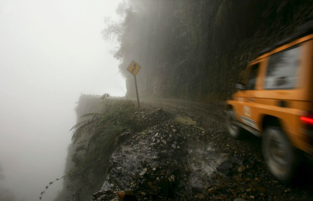 Jeep driving through heavy fog along Death Road