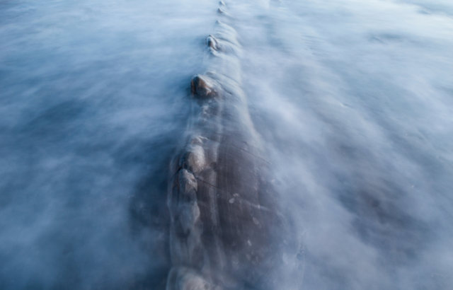 An eerie rock beneath the water