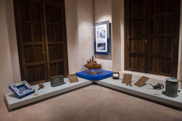 Items on display in the corner tables of a museum