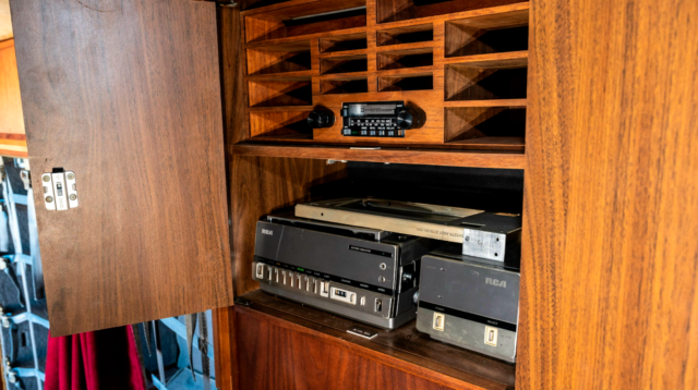 Cassette player and RCA VCR placed within wooden cabinetry