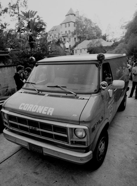 Coroner van in front of a crowd of people at the Chateau Marmont.