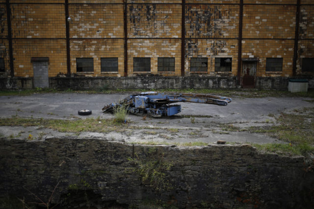 Abandoned piece of machinery in the middle of a courtyard