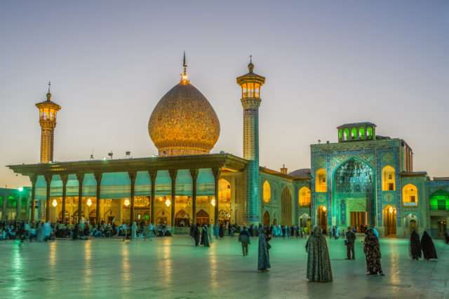 Exterior of the Shāh Chérāgh Mosque at twilight