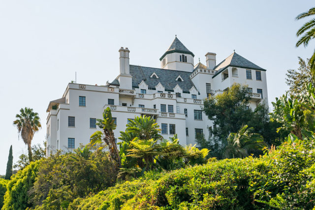Chateau Marmont sitting in a large patch of greenery. 