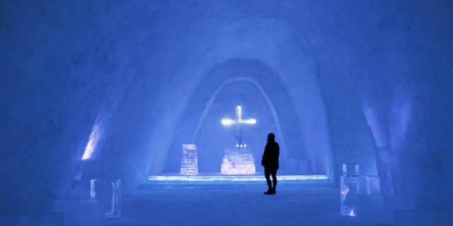 Person standing before the altar in the Schneekirche