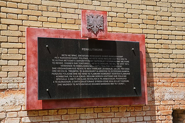 Memorial plaque on a brick wall