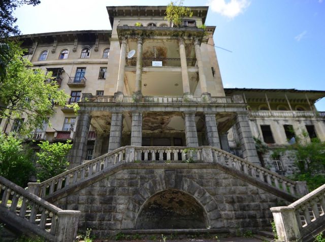 Elaborate front stairs leading up to an abandoned home in Tskaltubo.