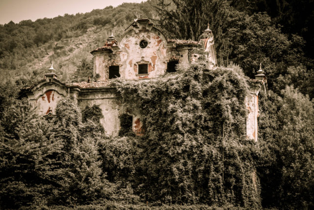 exterior of the mansion covered in vines