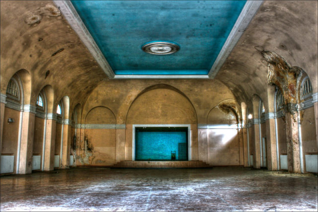 Open room with high ceilings inside abandoned officers housing. 